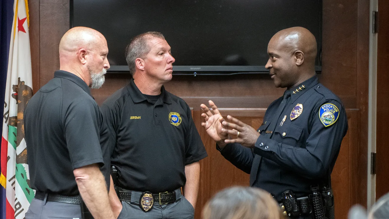 Chief McFadden Speaks to two other officers 